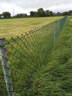 Chainlink fence installed around a field