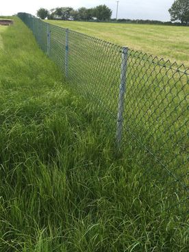 close-up of a chainlink fence around a field